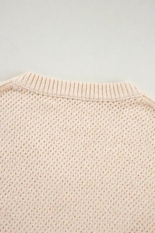 Cream-colored eyelet elegance drop sweater with ribbed collar and textured pattern