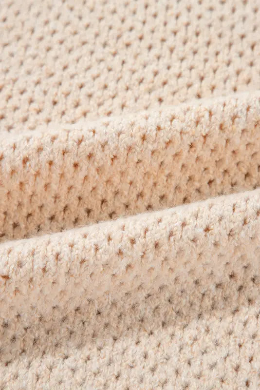 Cream-colored ’eyelet elegance drop sweater’ with textured, uniform knitted stitches