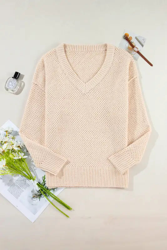 Pale pink eyelet elegance drop v-neck knitted sweater with long sleeves to relax