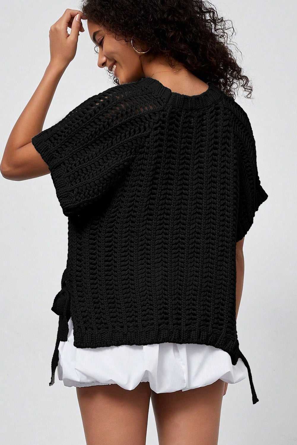 Back view of black Plus Size Bow Tie Open‑Knit Jumper for Women showing breathable knit texture and relaxed fit.