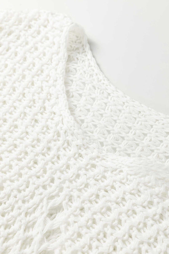 Close-up of white hollow knit jumper neckline, emphasizing the breathable open-knit texture and soft material.