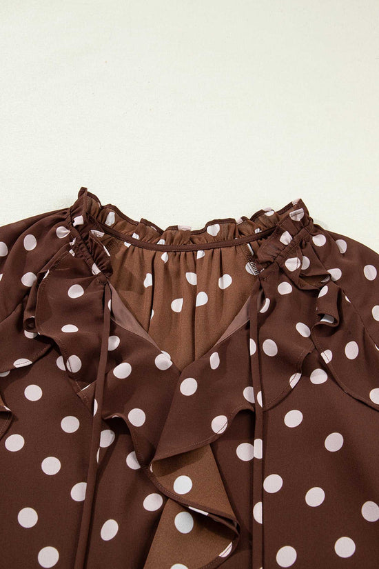 Close-up of the neckline on the coffee polka dot bell sleeve blouse, featuring a chiffon tie neck and soft ruffle trim for a feminine touch.