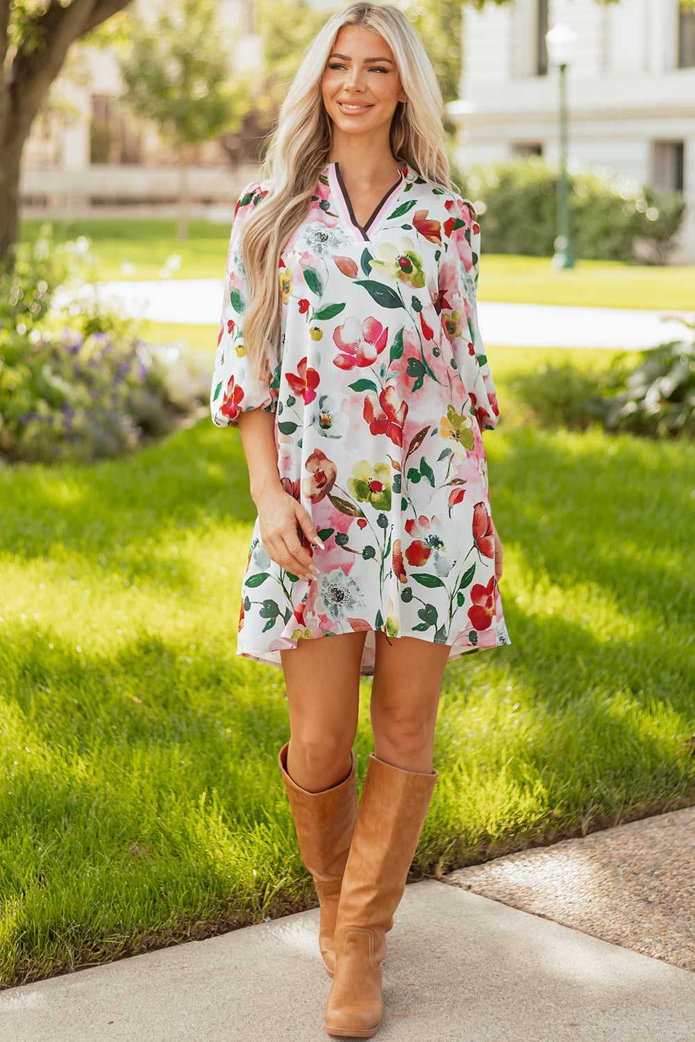 Full body view of model in Floral Shift Dress - Casual Elegance paired with tan boots, ideal for casual summer occasions.