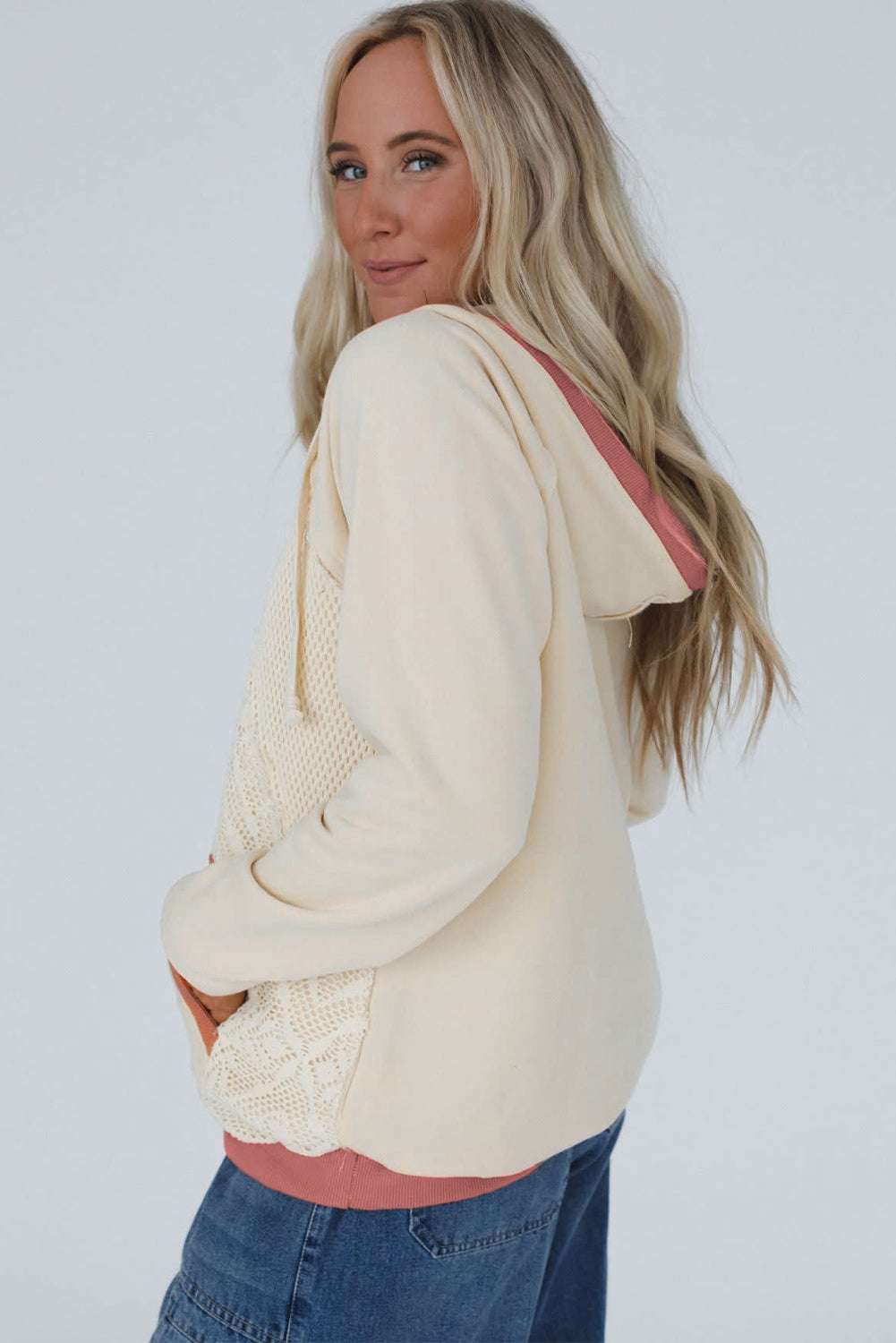 Back view of Women's White Contrast Trim Crochet Knit Hoodie showing hood lining in pink and soft cream fabric, ideal for daily wear.