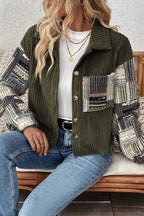 Seated model wearing Women's Green Plaid Corduroy Fleece Jacket paired with light blue jeans and white top for a cozy winter look.