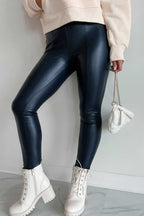 Black Vegan Leather Leggings – High‑Rise Skinny Fit paired with cream sweatshirt and white boots, perfect for fall casual outfits.