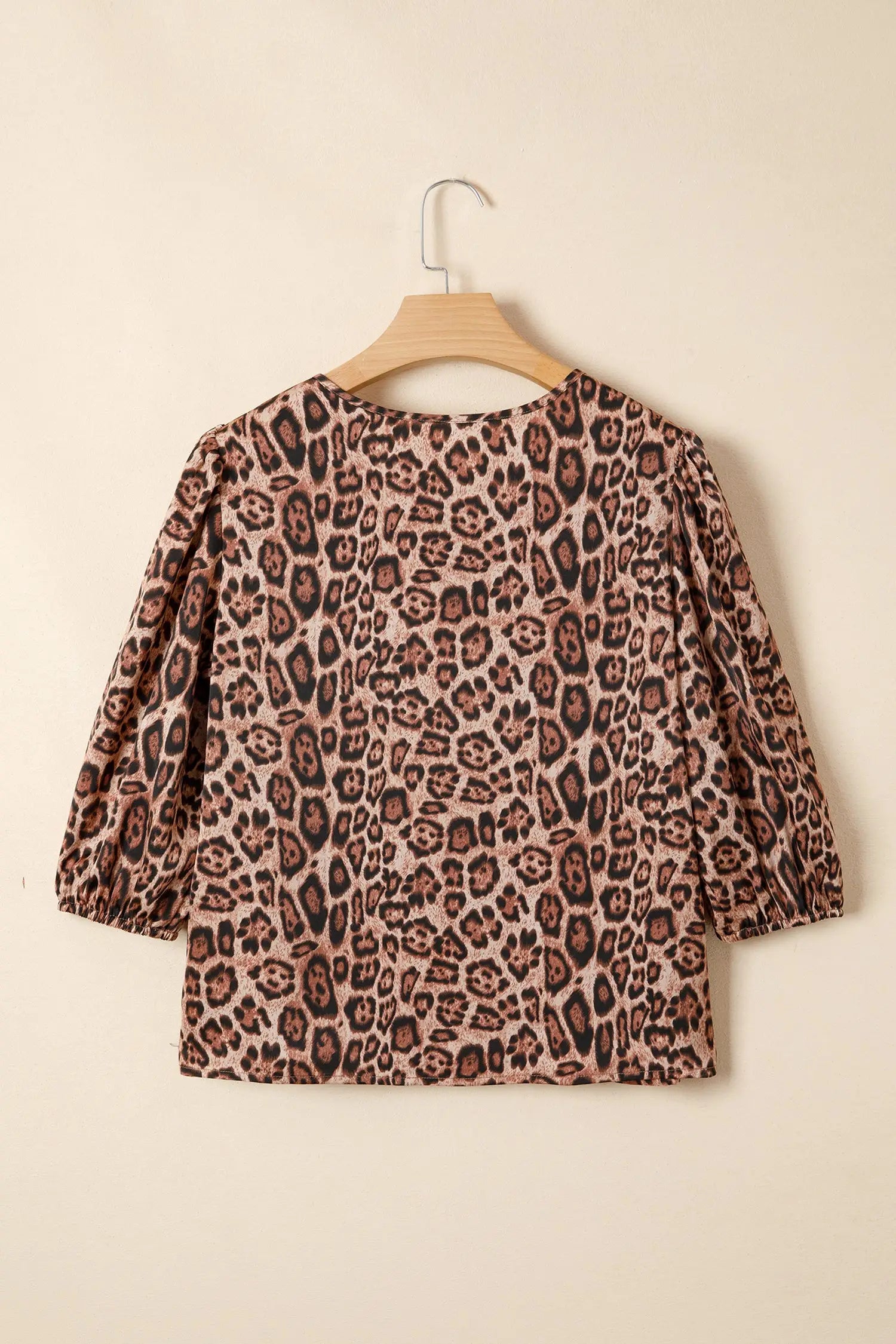 Close-up of brown leopard print fabric detail on puff sleeve bow neck blouse Fashionfitz UK