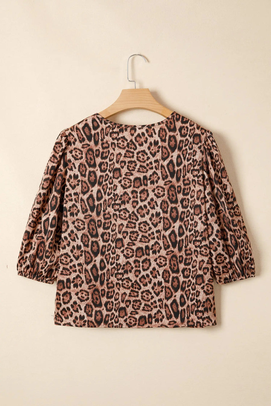 Close-up of brown leopard print fabric detail on puff sleeve bow neck blouse Fashionfitz UK