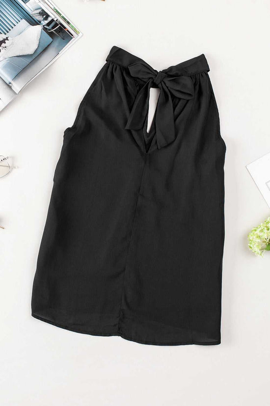 Back view of black keyhole halter tank top featuring self-tie halter neck and flowy sleeveless cut. Stylish summer top in solid black for women.
