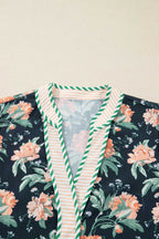 Close-up of neckline on Ladies Blue Floral Shift Mini Dress, showing green striped trim and floral pattern for a stylish bohemian look.