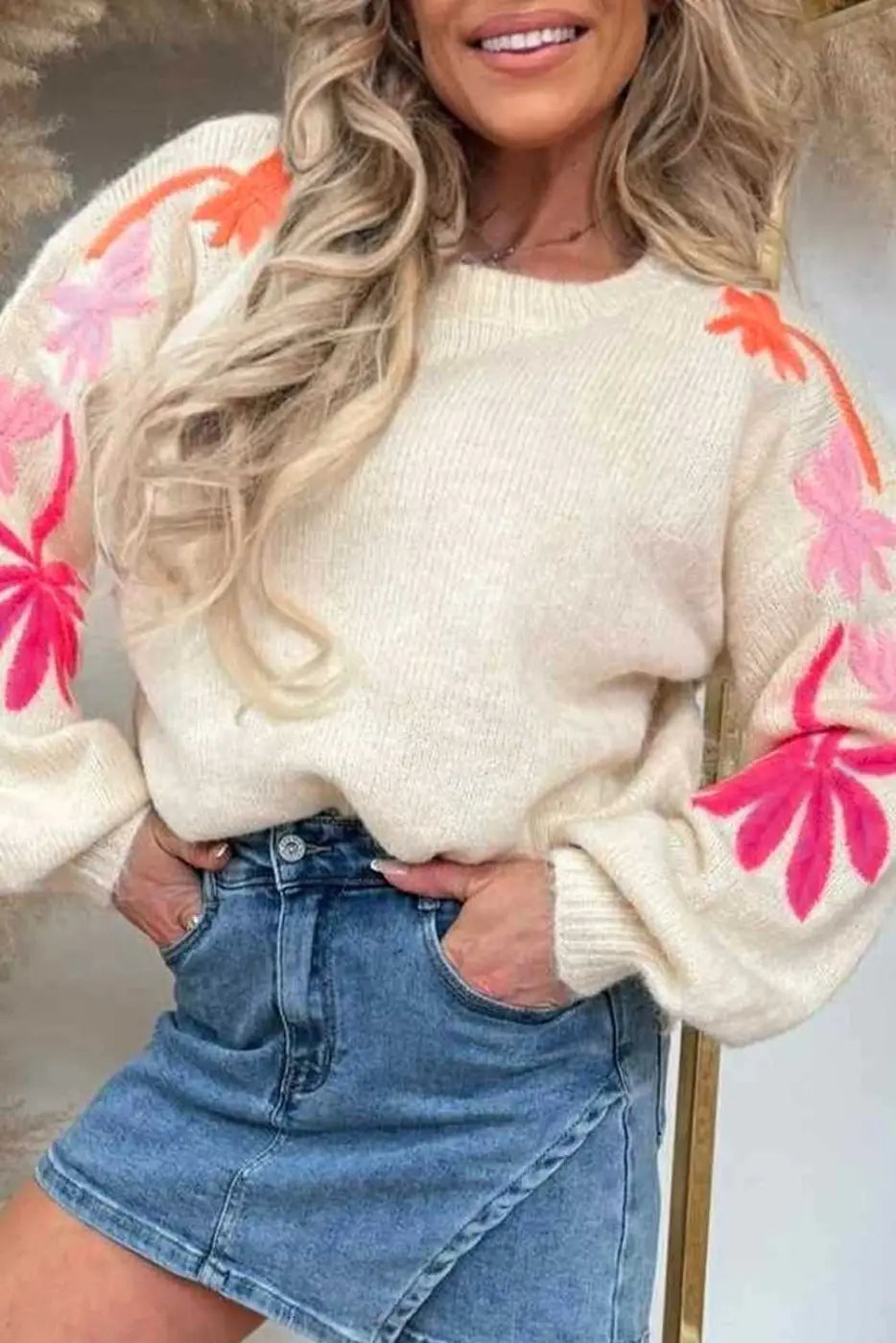 Women's Floral Embroidered Sleeve Jumper in cream with pink and orange flower accents, styled with a denim skirt for a chic autumn outfit.