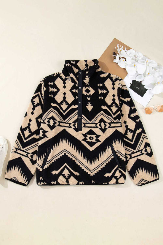 Flat lay of Women's Black Plus Size Aztec Print Plush Sweatshirt with snap-button collar and soft fleece fabric, ideal for winter layering.