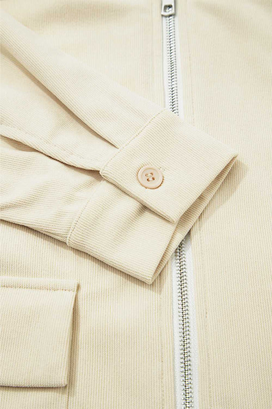 Cuff and button detail of the Leather Collar Corduroy Jacket, showcasing craftsmanship and casual styling elements.