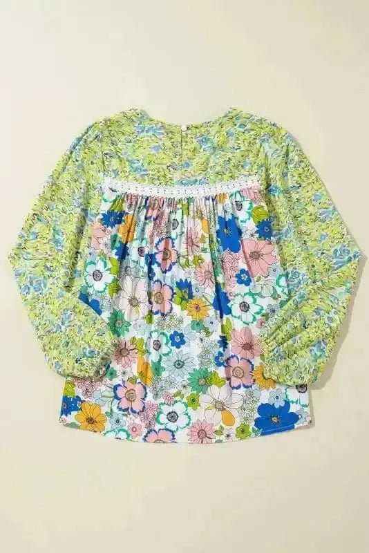 Close-up of Green Floral Puff Sleeve Blouse showing vibrant mixed blossom print on smooth 100% viscose fabric — Fashionfitz