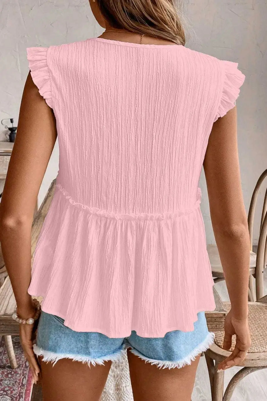 Back view of Pink Solid Ruffle Trim Flowy Top showing flowy silhouette and short sleeve on 97% polyester-elastane — Fashionfitz