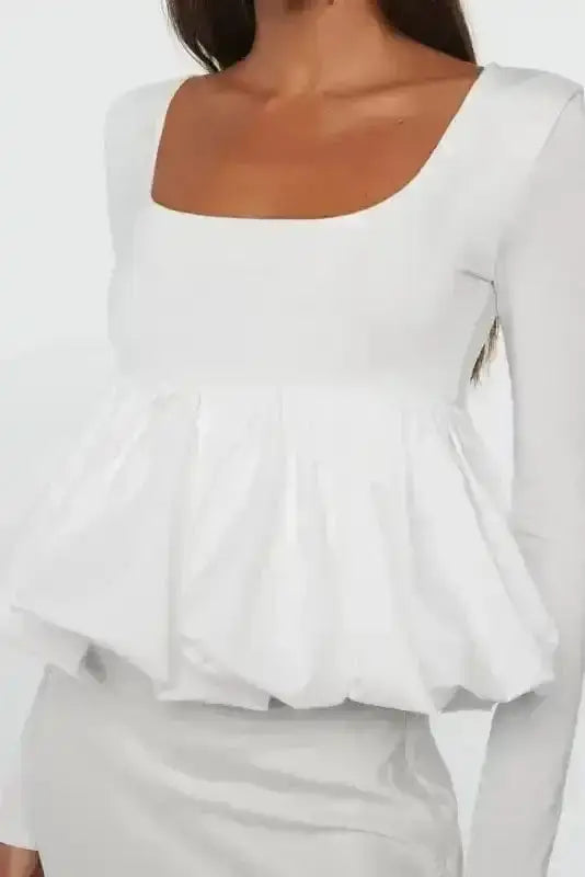 Close-up of Bubble Hem U-Neck Long Sleeve Crop Top showing bubble hem construction on fluid 93% viscose fabric — Fashionfitz