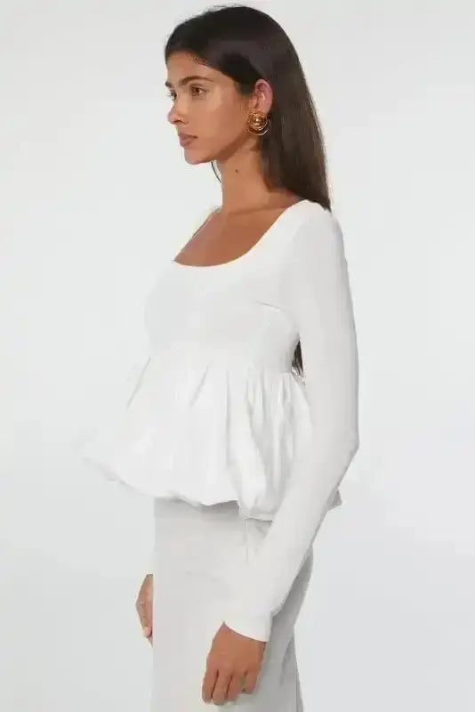 Side view of Bubble Hem U-Neck Long Sleeve Crop Top showing distinctive rounded bubble hem and U-neckline — Fashionfitz