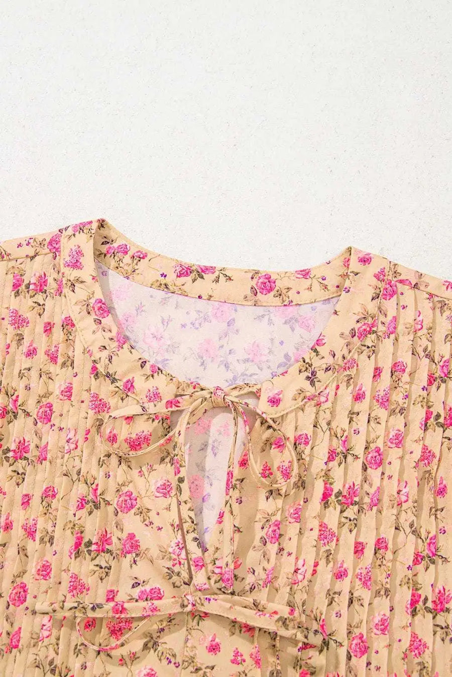 Close-up of Floral Half Sleeve Boho Casual Puff Blouse showing delicate floral print in warm beige tones on 100% polyester — Fashionfitz
