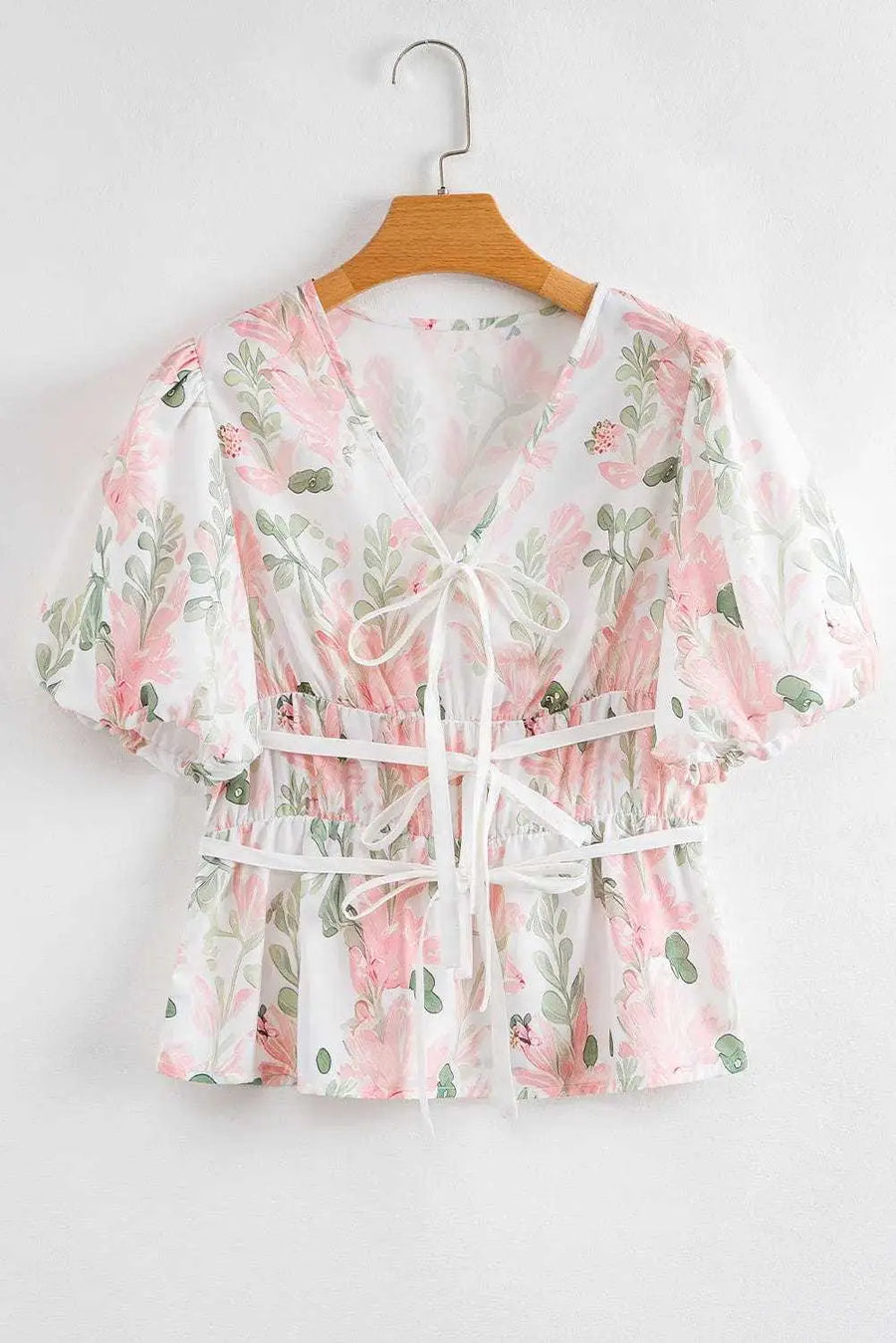 Close-up of Floral Puff Sleeve Peplum Blouse showing vibrant pink floral print and peplum hem detail — Fashionfitz