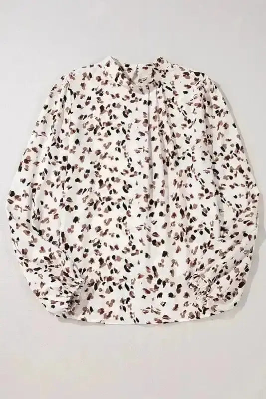 Close-up of Leopard Print Mock Neck Puff Sleeve Pleated Blouse showing bold leopard print on pleated polyester fabric — Fashionfitz