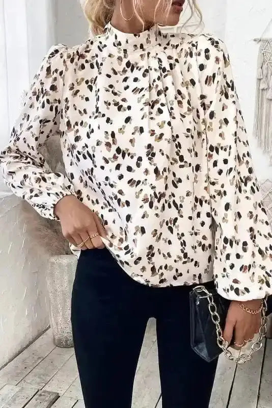 Side view of Leopard Print Mock Neck Puff Sleeve Blouse showing lantern puff sleeve shape and pleated fabric — Fashionfitz