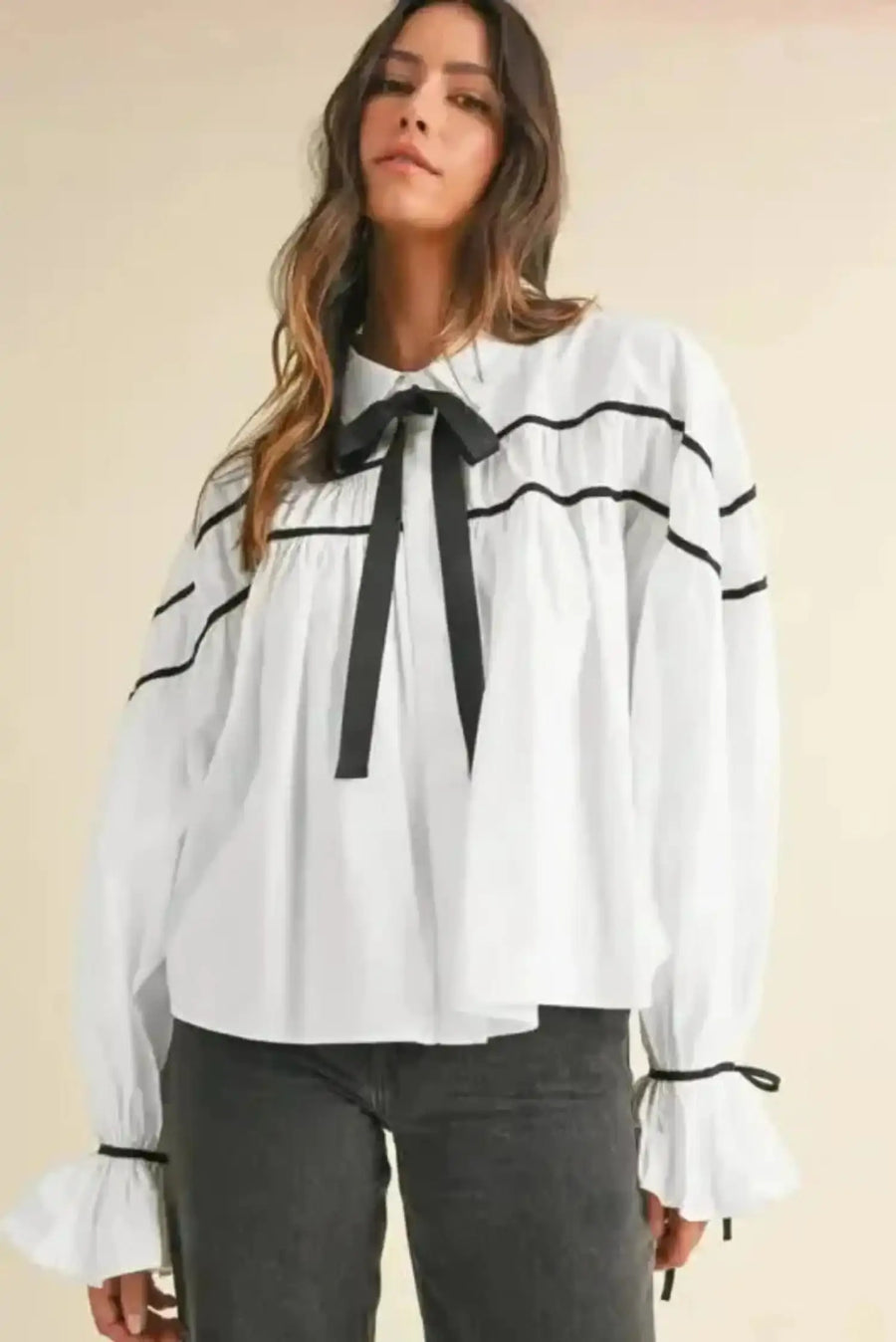 Close-up of Monochrome Striped Bowtie Blouse showing delicate bowtie detail and black piping on 100% cotton — Fashionfitz