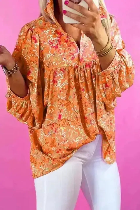 Orange abstract print V-neck flowy babydoll blouse front view — Fashionfitz UK