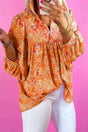 Abstract Print V-Neck Babydoll Blouse Women UK in orange — front view showing abstract print and flowing babydoll silhouette — Fashionfitz
