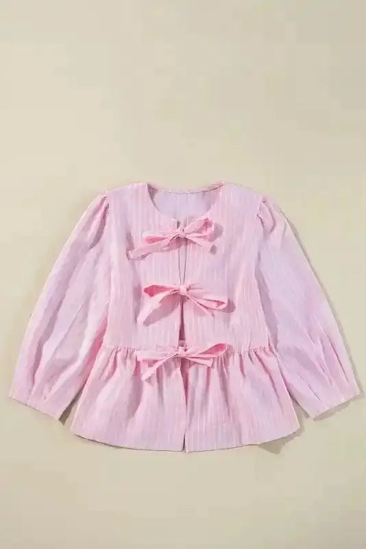 Close-up of Pink Striped Puff Sleeve Ruffle Blouse showing delicate bowknot detail and soft pink stripe on poly-viscose fabric — Fashionfitz