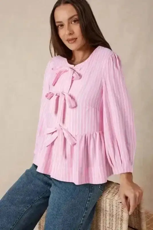 Side view of Pink Striped Puff Sleeve Ruffle Blouse showing puff sleeve structure and bowknot neckline detail — Fashionfitz