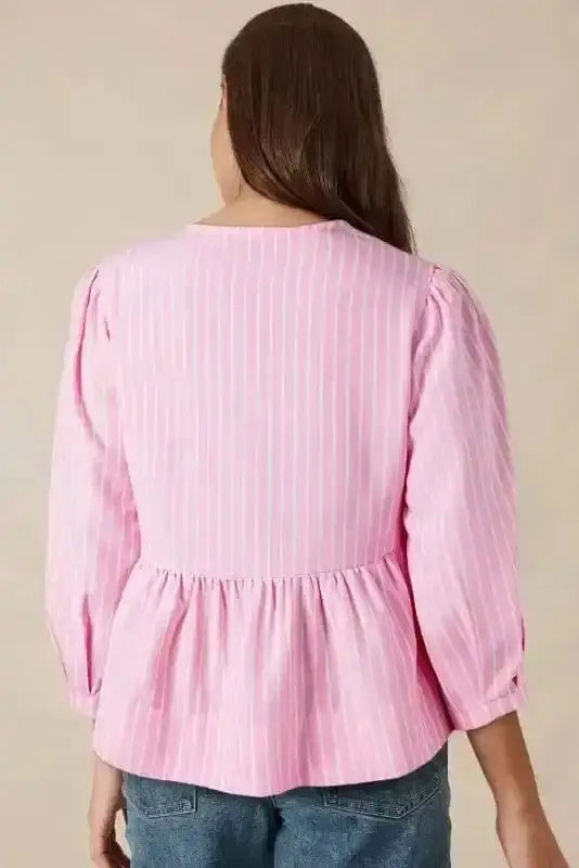 Back view of Pink Striped Puff Sleeve Ruffle Blouse showing long sleeve silhouette and relaxed fit — Fashionfitz