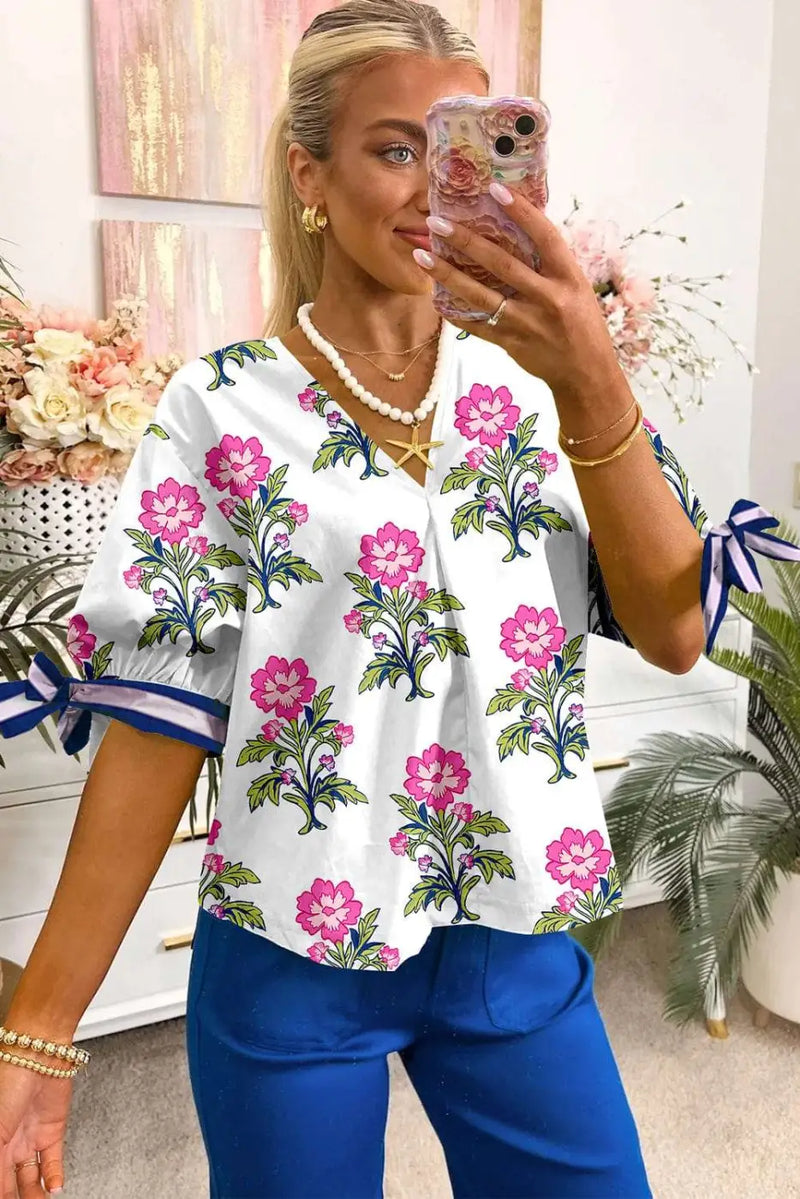 Back view of White Floral Bubble Sleeve V-Neck Summer Blouse showing bubble sleeve structure and shirred bodice — Fashionfitz