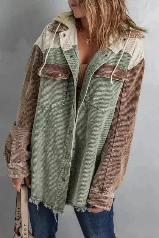Woman wearing green colour block hooded corduroy jacket with button-down front Fashionfitz UK