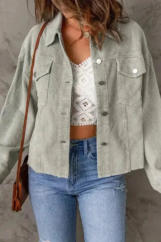 Close-up of flap pocket and corduroy fabric texture on sky blue cropped jacket Fashionfitz UK
