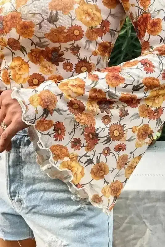 Orange Floral Bell Sleeve Crop Top Women UK styled as a charming holiday vacation outfit — Fashionfitz