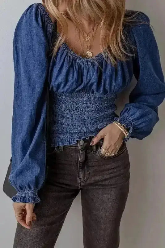 Side view of Blue Denim Smocked Ruffle Sleeve Blouse showing ruffle sleeve detail and cropped denim silhouette — Fashionfitz
