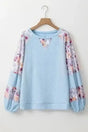 Blue Floral Patchwork Textured Artisan Blouse Women UK in beau blue — front view showing rich floral patchwork and boat neckline — Fashionfitz