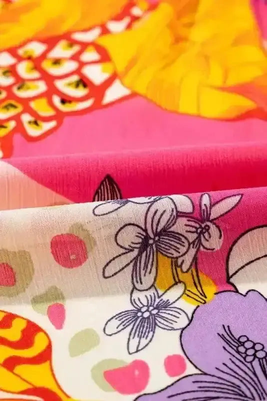 Close-up of Orange Floral Bubble Sleeve Abstract Blouse showing vibrant orange abstract floral print and bubble sleeve gathering — Fashionfitz