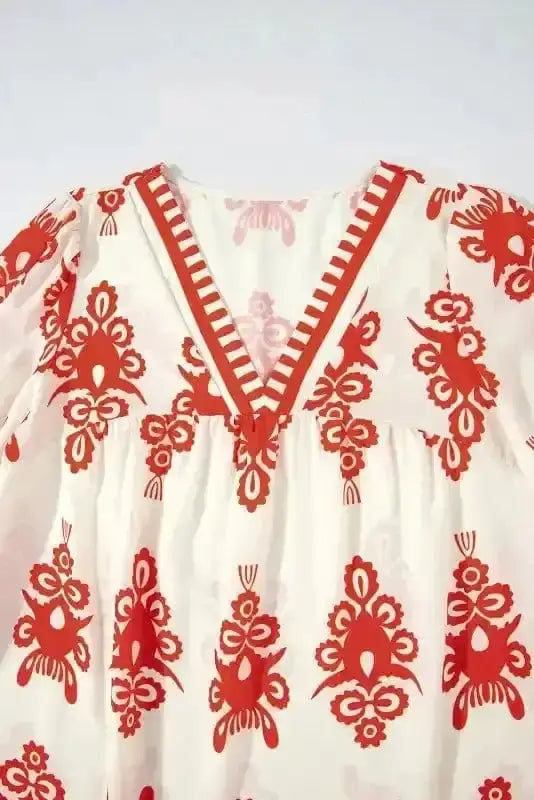 Close-up of Orange Geometric Paisley V-Neck Boho Blouse showing intricate geometric paisley print pattern — Fashionfitz