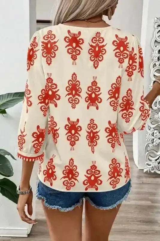Back view of Orange Geometric Paisley V-Neck Boho Blouse showing three-quarter sleeves and relaxed silhouette — Fashionfitz