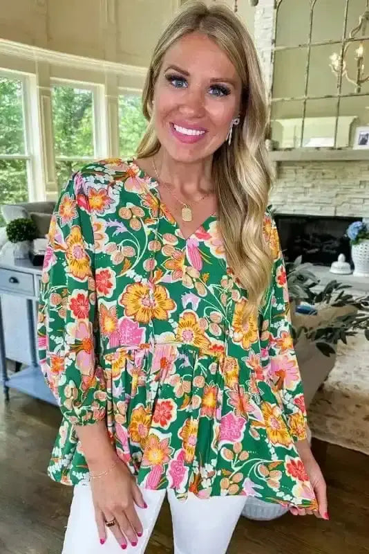 Close-up of Daisy Floral Embroidered Peplum Blouse showing delicate daisy embroidery stitching on green polyester — Fashionfitz