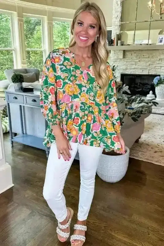 Side view of Daisy Floral Embroidered V-Neck Peplum Blouse showing peplum flare and shirred bodice — Fashionfitz