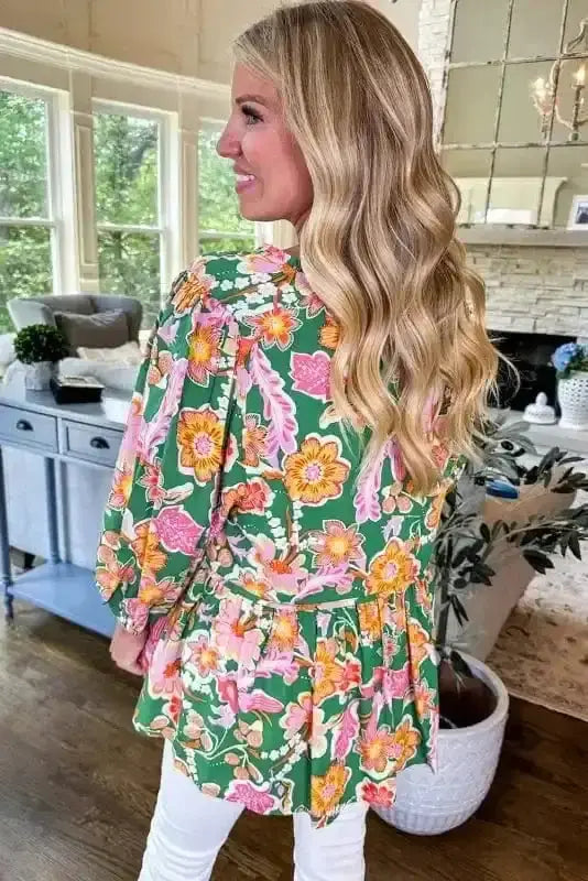 Back view of Daisy Floral Embroidered Peplum Blouse showing long sleeves and flattering peplum silhouette — Fashionfitz