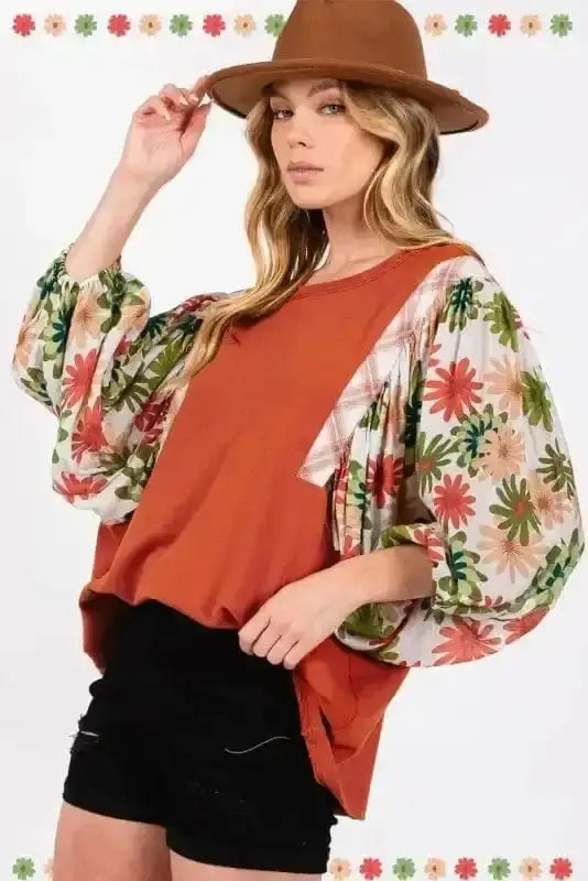 Back view of Orange Floral Puff Sleeve Spring Blouse showing round neckline and puff sleeve silhouette — Fashionfitz