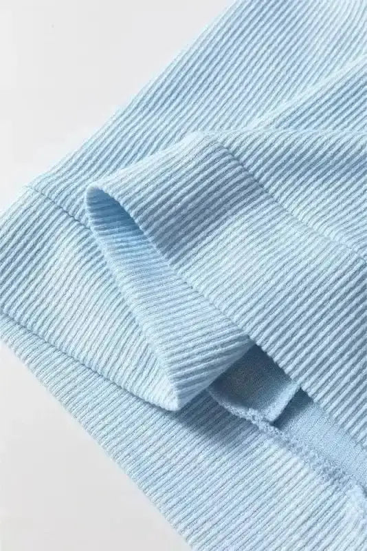 Side view of Blue Floral Patchwork Artisan Blouse showing textured poly-cotton-elastane fabric and ruffled detail — Fashionfitz