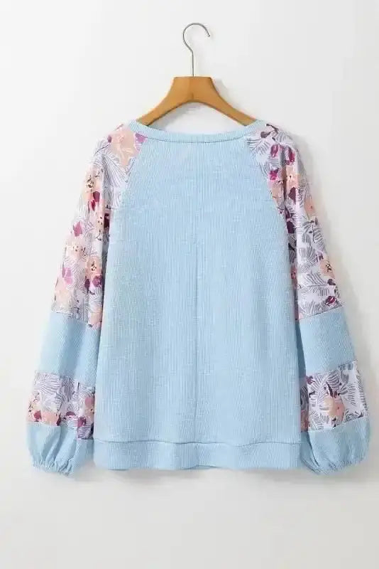 Back view of Blue Floral Patchwork Textured Artisan Blouse showing long sleeves and textured silhouette — Fashionfitz