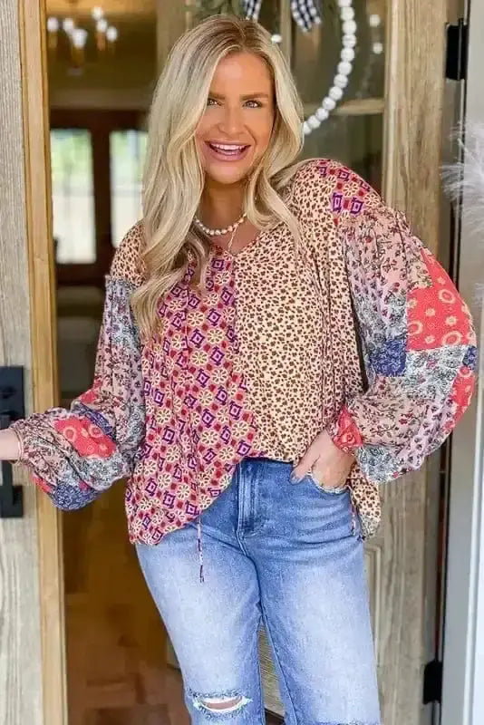 Close-up of Pink Floral Tied V-Neck Colour Block Blouse showing self-tie bow at V-neckline and vibrant floral print — Fashionfitz
