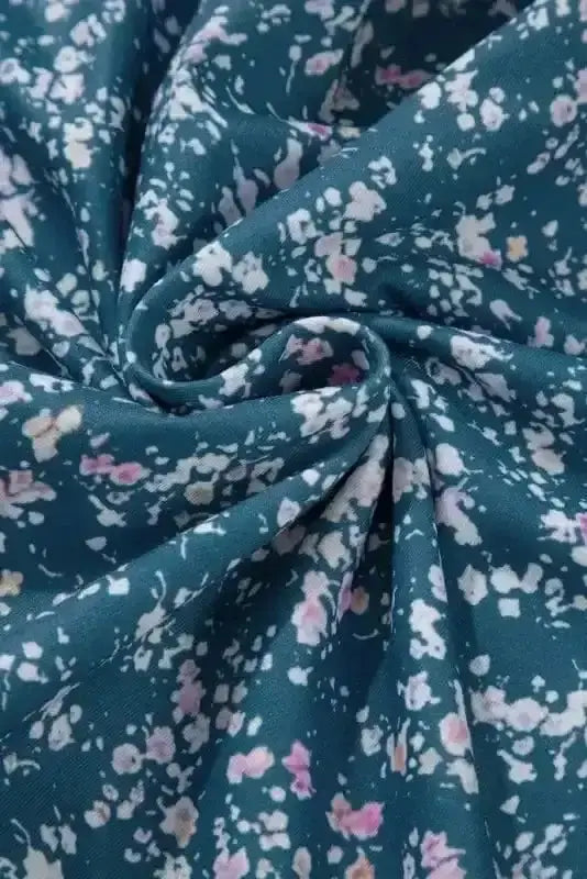 Close-up of Floral Colour Block Ruffle Hem Blouse showing vibrant mosaic floral colour block and ruffled hem construction — Fashionfitz