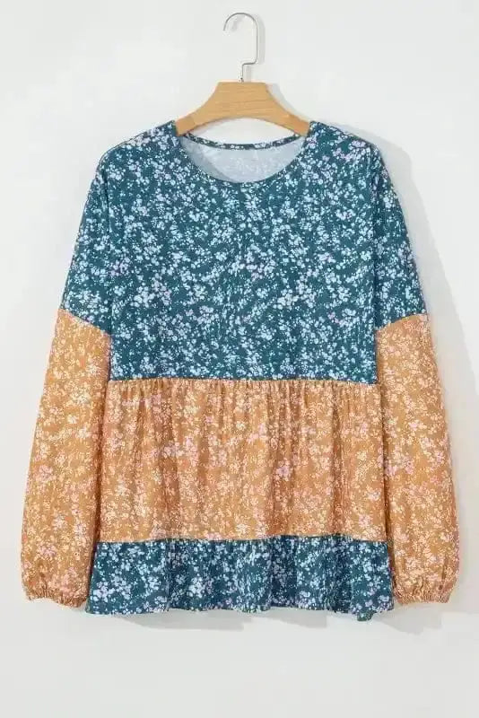 Side view of Floral Mosaic Ruffle Hem Blouse showing ruffled hem detail and comfortable stretch fit — Fashionfitz