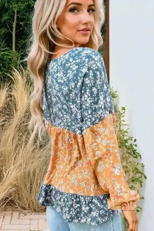 Back view of Floral Colour Block Ruffle Hem Blouse showing long sleeves and ruffle hem silhouette — Fashionfitz